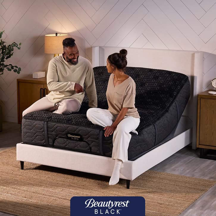 Beautyrest Black mattress on an adjustable base in a contemporary bedroom, featuring a promotion for a $300 Instant Gift.