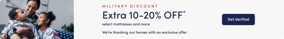 Military family sitting together on a couch with an American flag blanket, next to a banner promoting a military discount of an extra 10–20% off select mattresses and more, with a button to get verified.