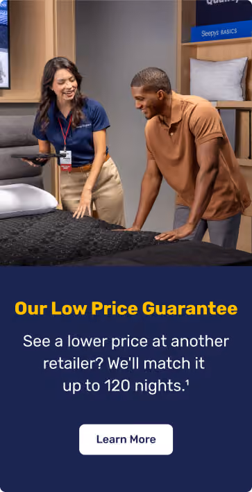 Mattress Firm associate helps a customer shop for a mattress. Low Price Guarantee matches a lower retailer price for up to 120 nights.