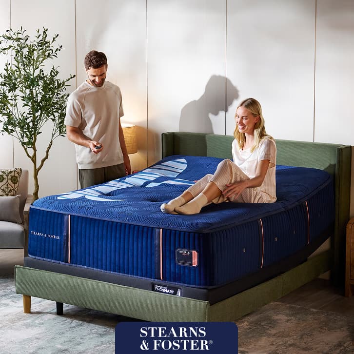 Luxurious Stearns & Foster adjustable mattress set shown in a stylish bedroom, with a promotion offering up to $300 Instant Gift.